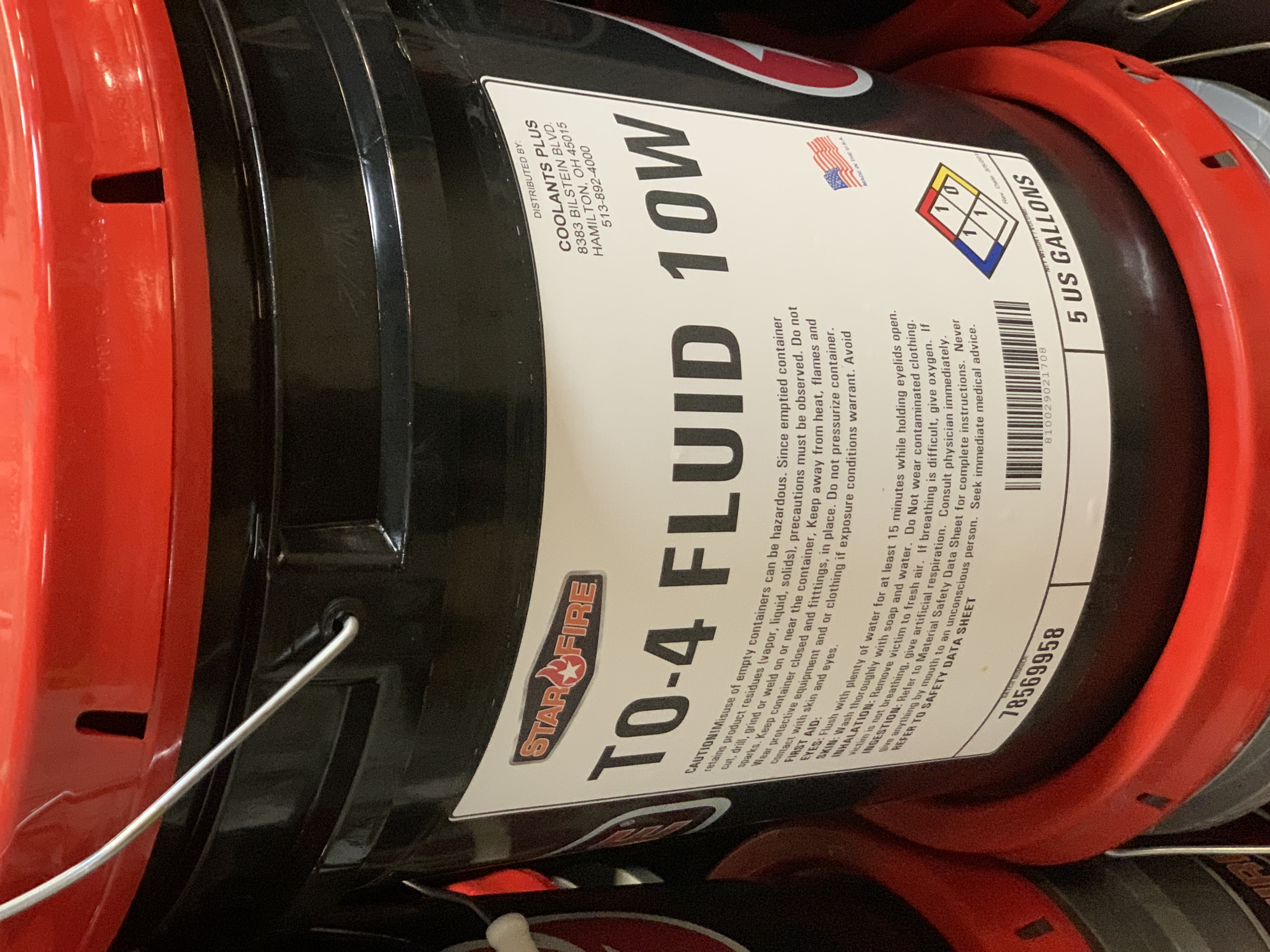 TO-4 10W fluid drum product label close-up